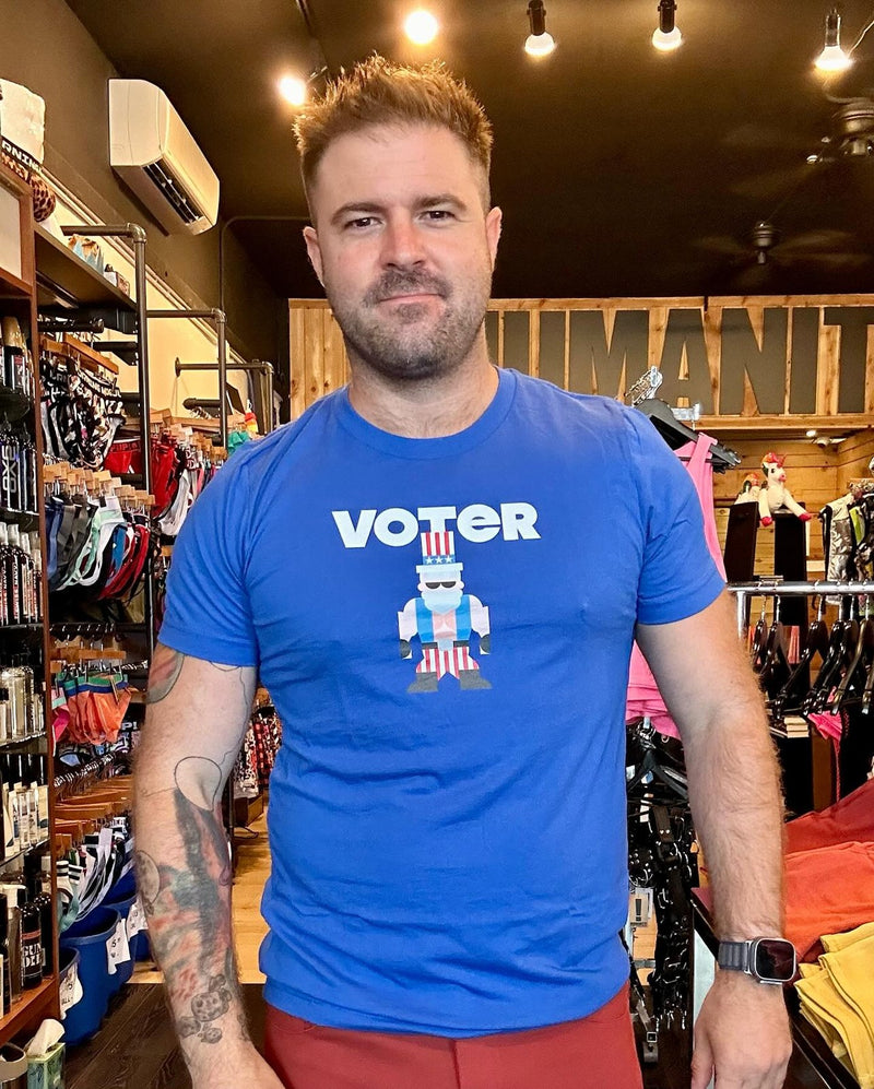 A man in the blue Voter Sam tee at Humanity in San Diego